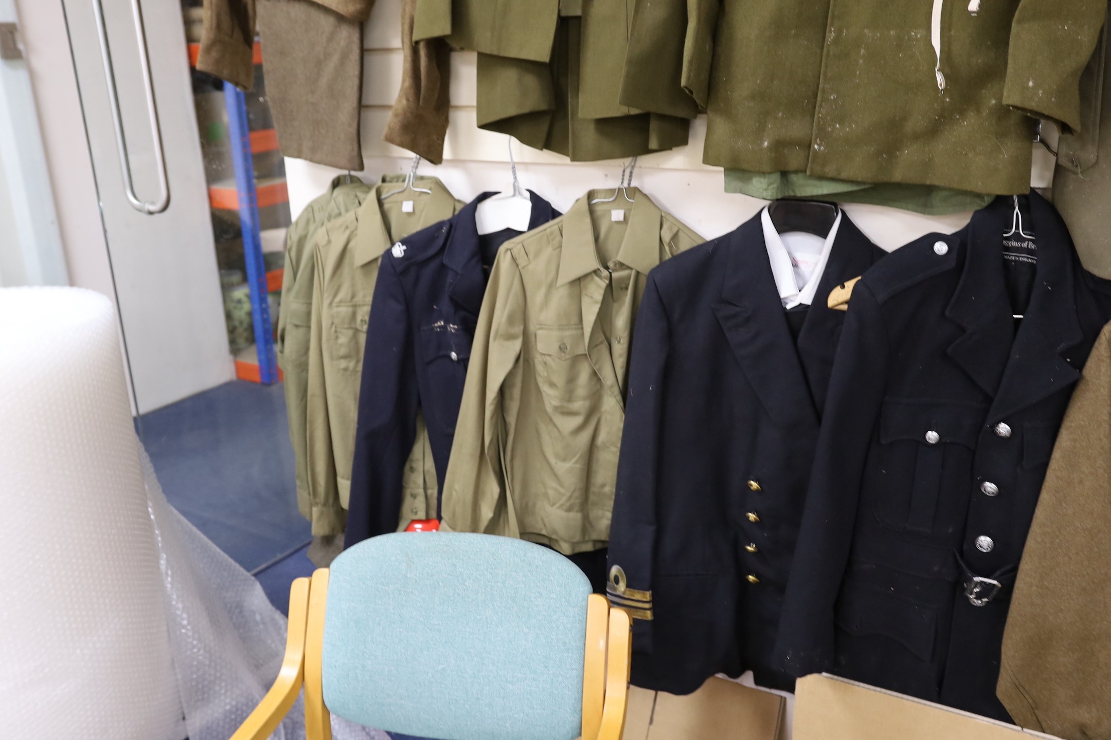 A collection of mixed Royal Navy and army military uniforms, including Royal Australian Corps of Signals (woman’s), Royal Artillery, Russian Army etc.